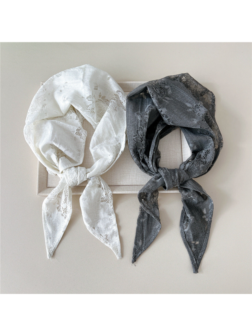 White and Gray floral lace scarves tied side by side