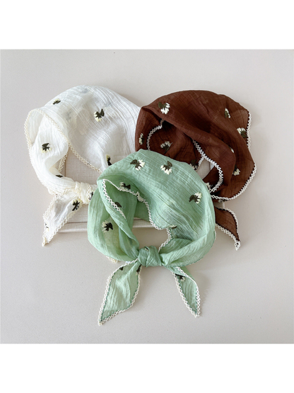 Cream, Mint and Brown floral scarves arranged in knotted loops