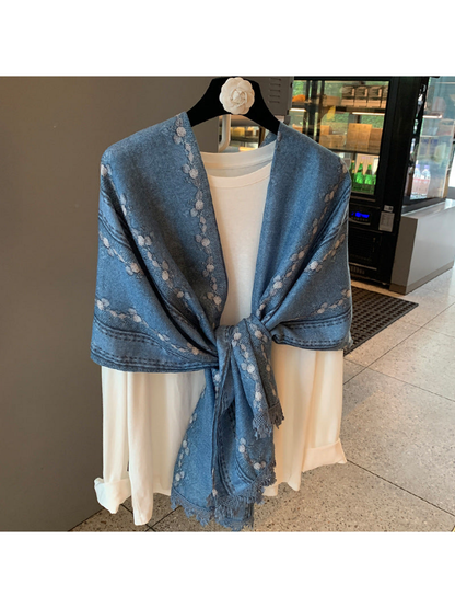 Blue floral and striped scarf tied at the front over a white top