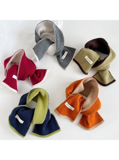Navy, Mustard, Gray, Red and Orange knit scarves arranged in loops