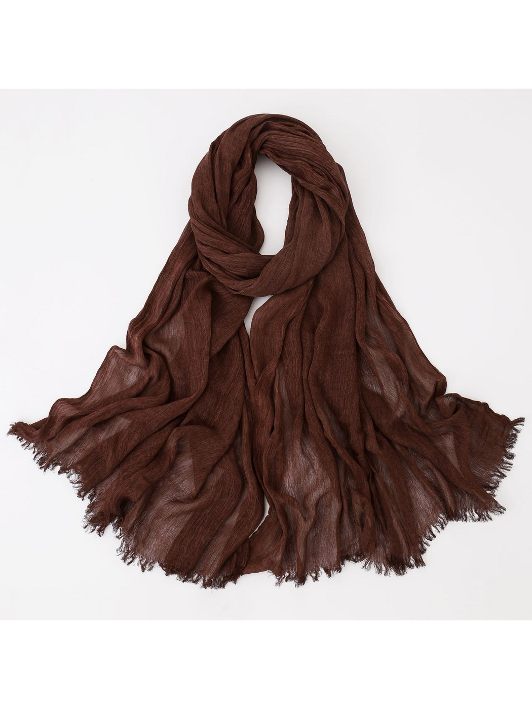 Brown scarf looped with crinkled texture and fringed edges