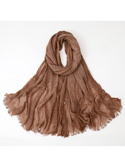 Camel scarf looped with crinkled texture and fringed edges