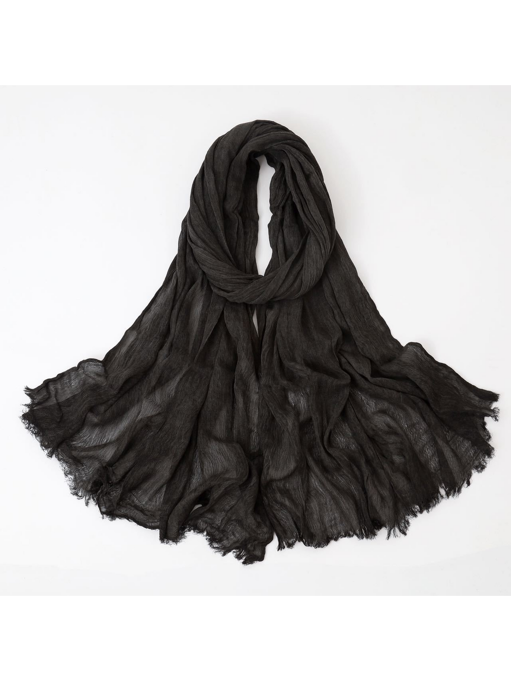 Black scarf looped with crinkled texture and fringed edges