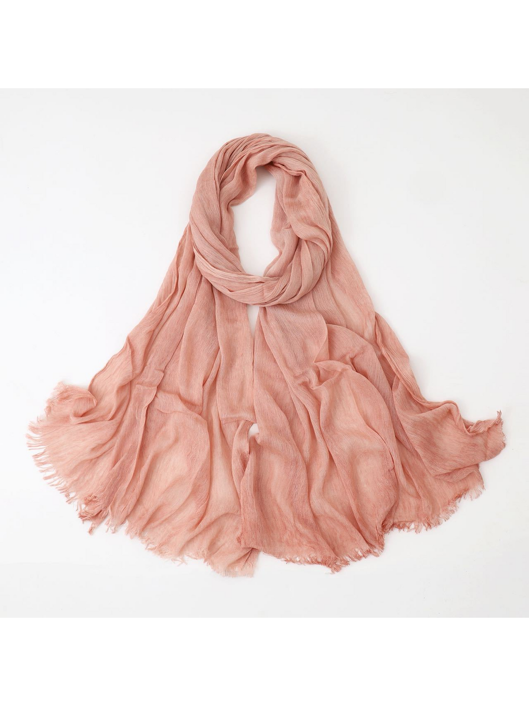 Pink scarf looped with crinkled texture and fringed edges