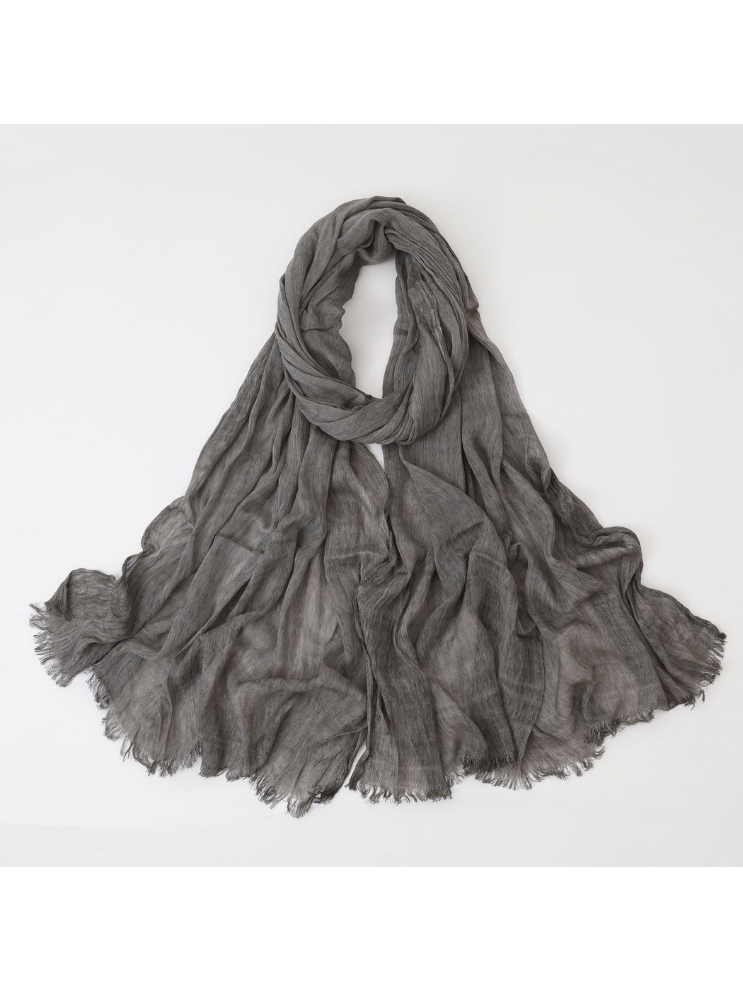 Gray scarf looped with crinkled texture and fringed edges