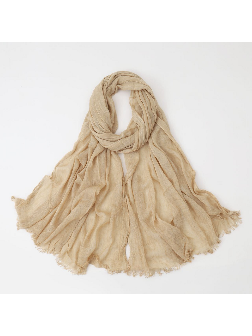 Beige scarf looped with crinkled texture and fringed edges