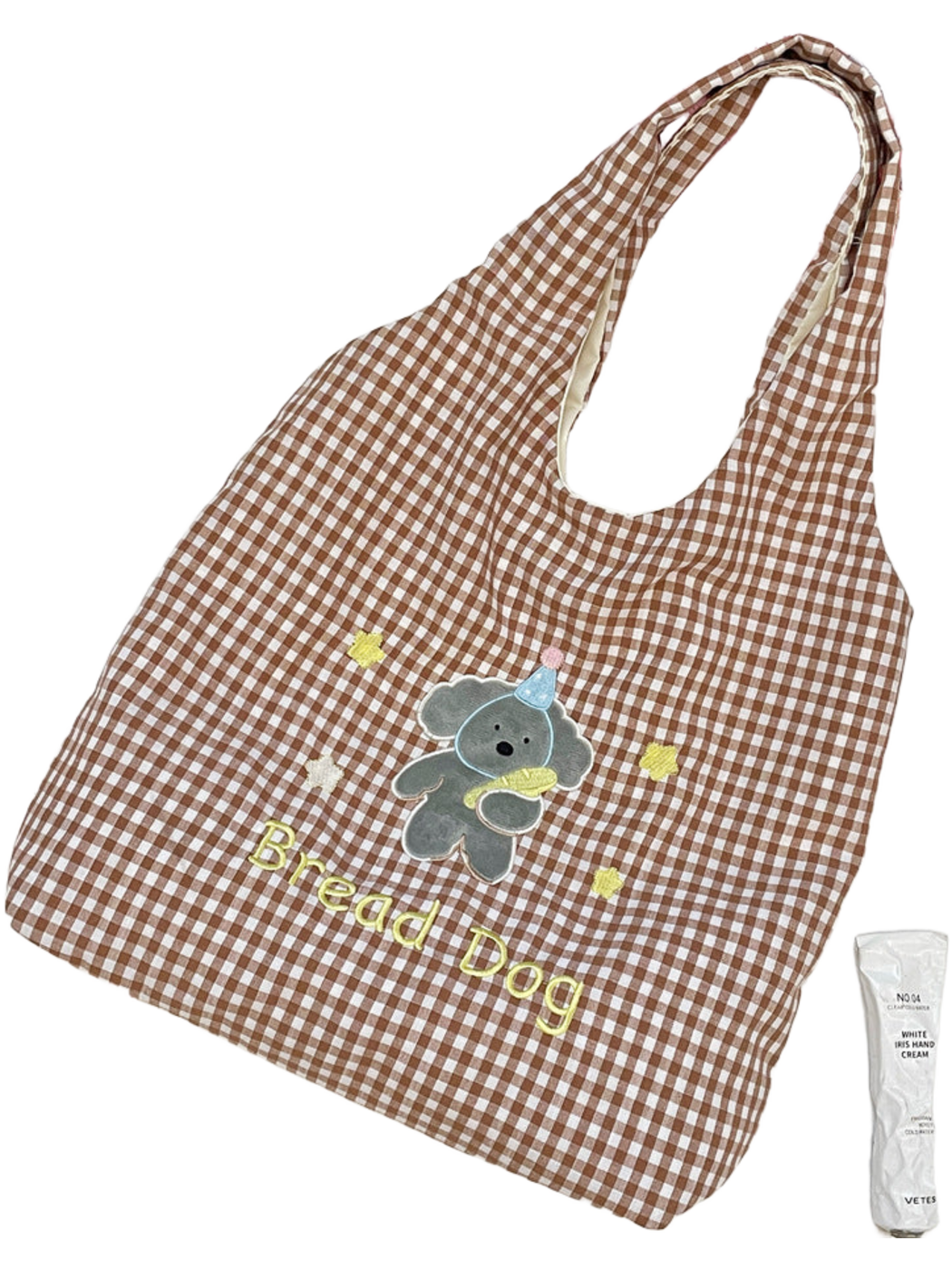 Brown gingham tote bag with a gray cartoon dog and Bread Dog lettering, flat view
