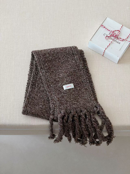 Brown marled knit scarf folded with long twisted fringe
