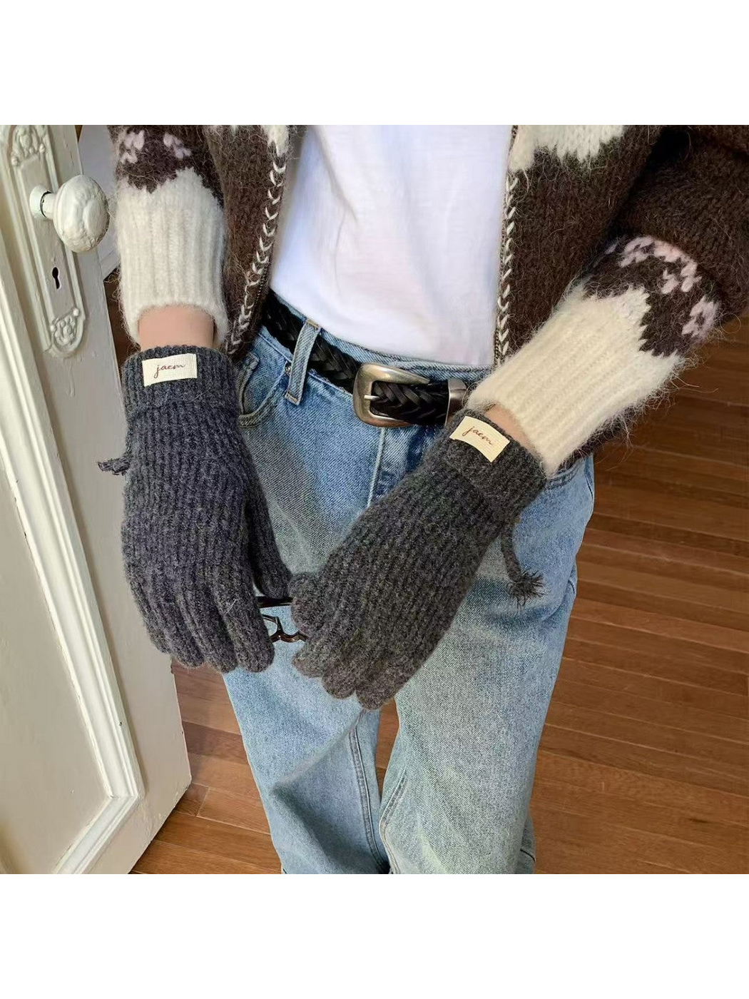Gray ribbed gloves worn with folded cuffs and cuff labels visible