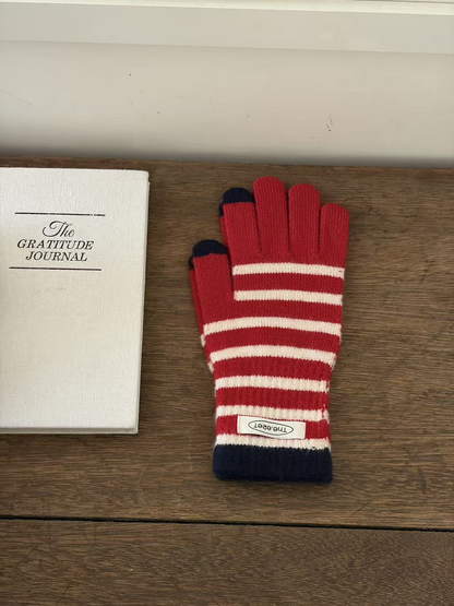 Red glove with white stripes, navy cuff and contrasting fingertips