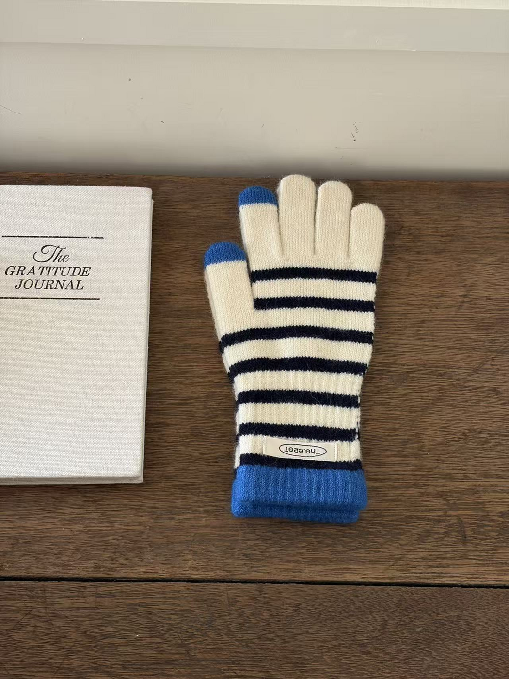 Ivory glove with navy stripes, blue cuff and contrasting fingertips