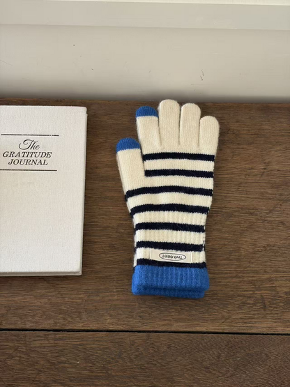 Ivory glove with navy stripes, blue cuff and contrasting fingertips