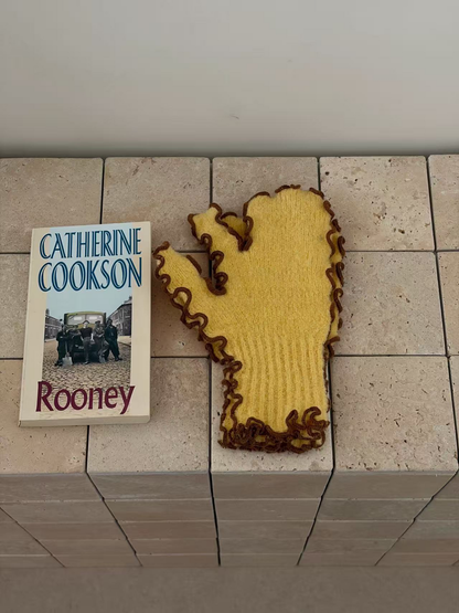 Yellow mittens with brown ruffled edging and ribbed cuffs