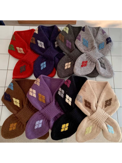 Eight scarf colors displayed together with contrasting geometric motifs and ribbed loops