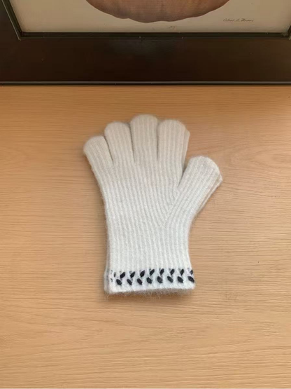 White ribbed gloves with dark leaf-like cuff embroidery