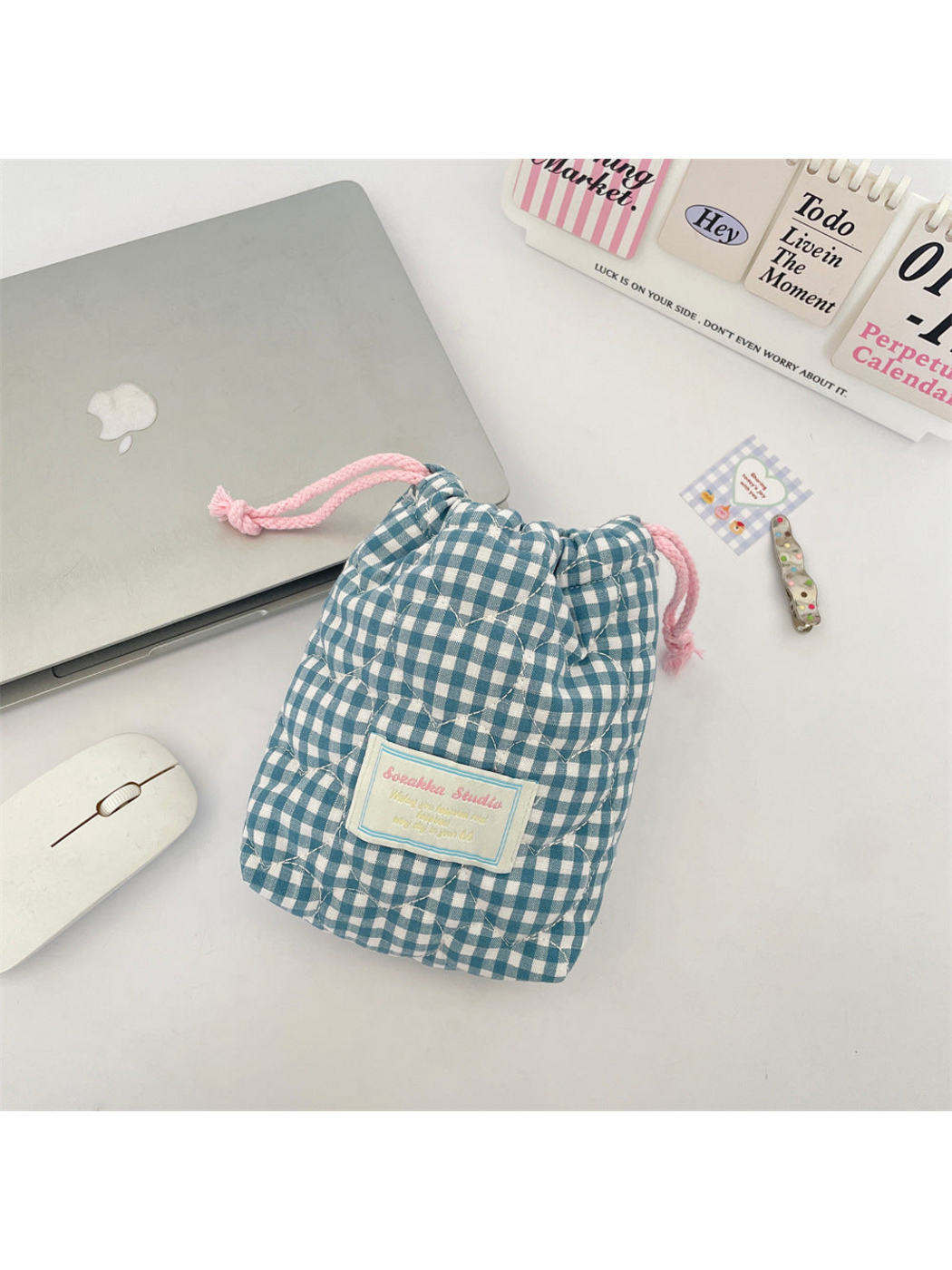 Teal Blue gingham drawstring pouch with curved quilting and pink drawcords, front view