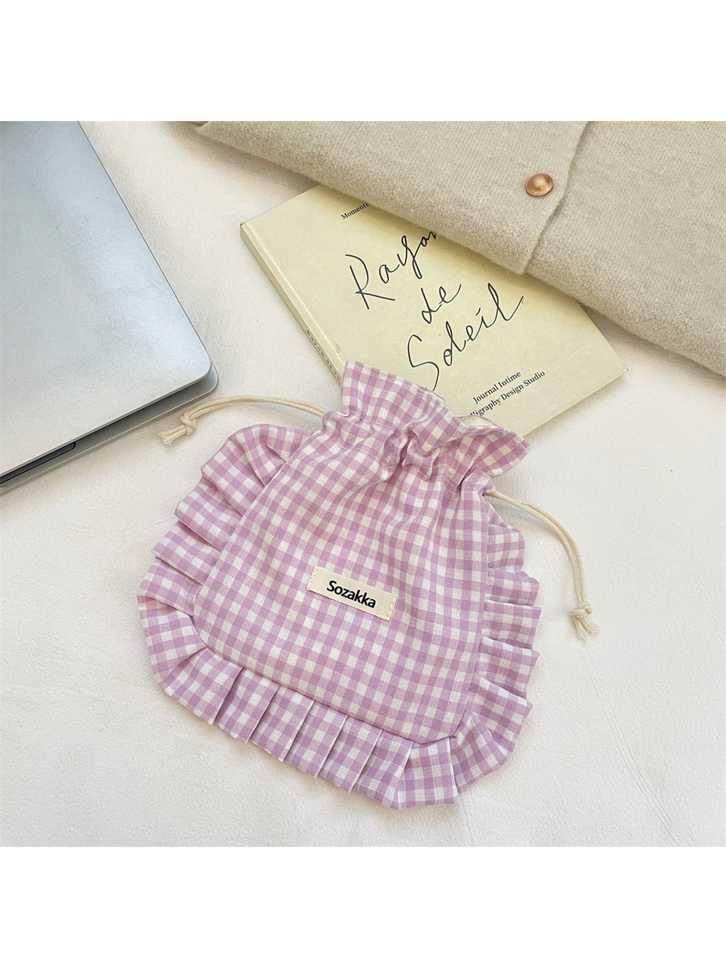 Light Purple gingham drawstring pouch with ruffled trim, laid flat
