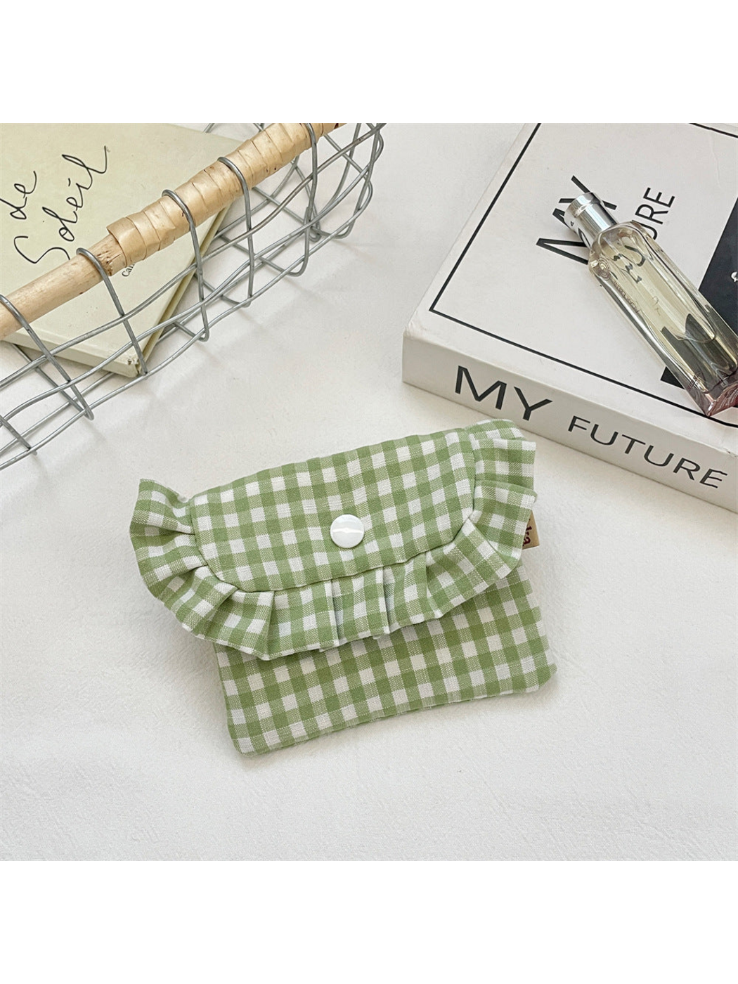 Green gingham coin purse with a ruffled flap and white snap, front view