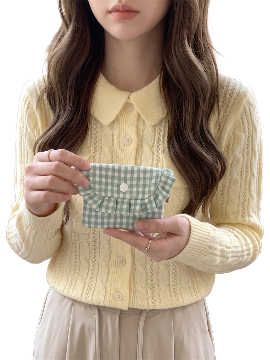 Mint gingham coin purse held front-facing, showing the ruffled flap and white snap