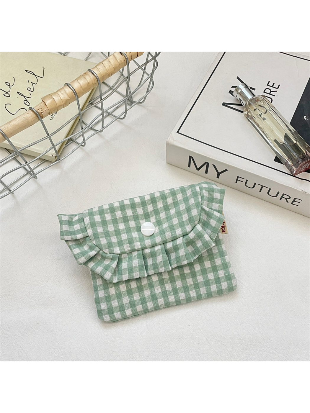 Mint gingham coin purse with a ruffled flap and white snap, front view