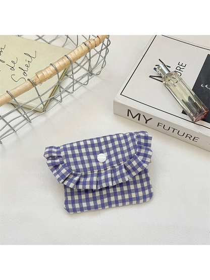 Purple gingham coin purse with a ruffled flap and white snap, front view