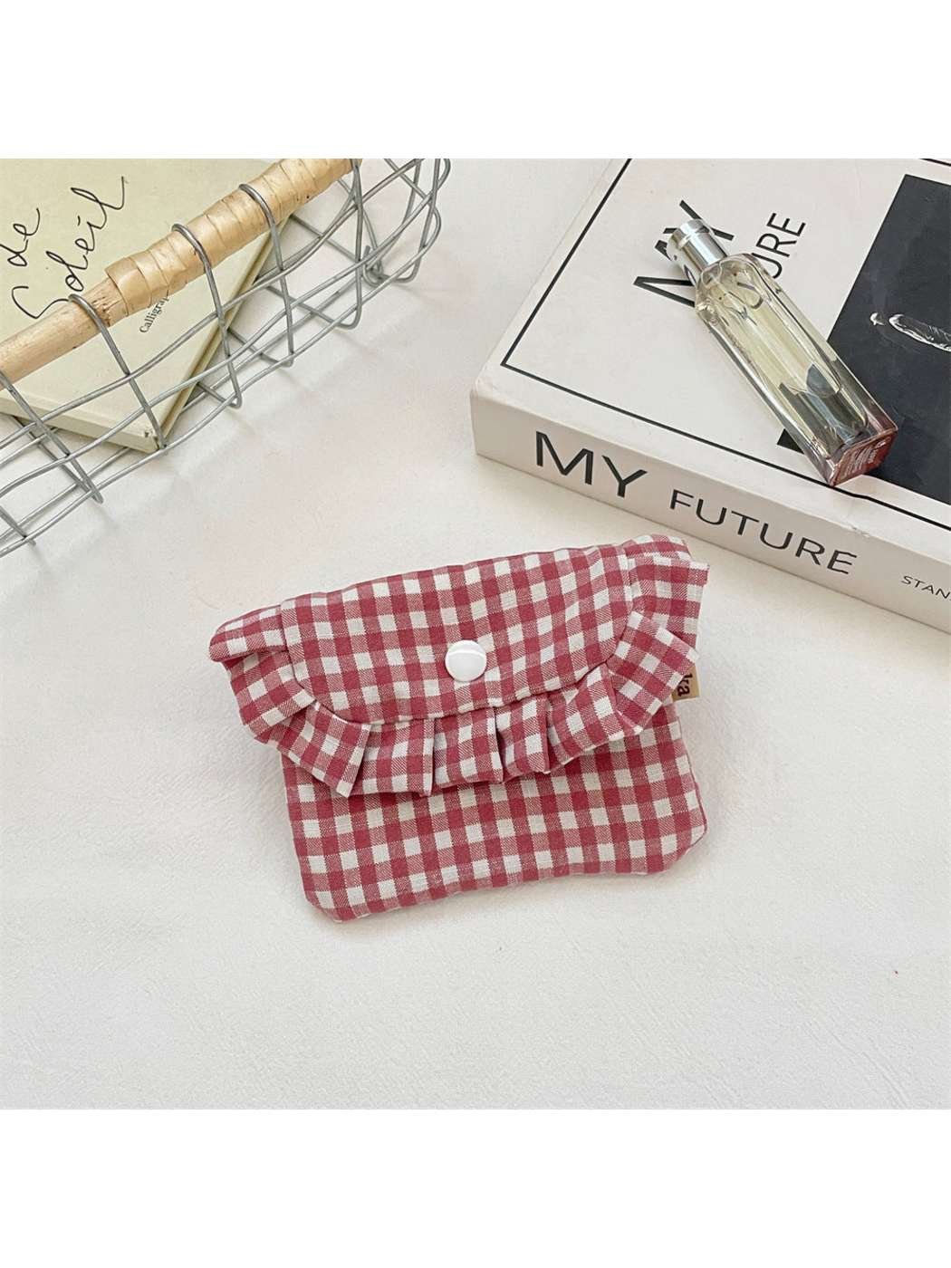 Burgundy gingham coin purse with a ruffled flap and centered white snap
