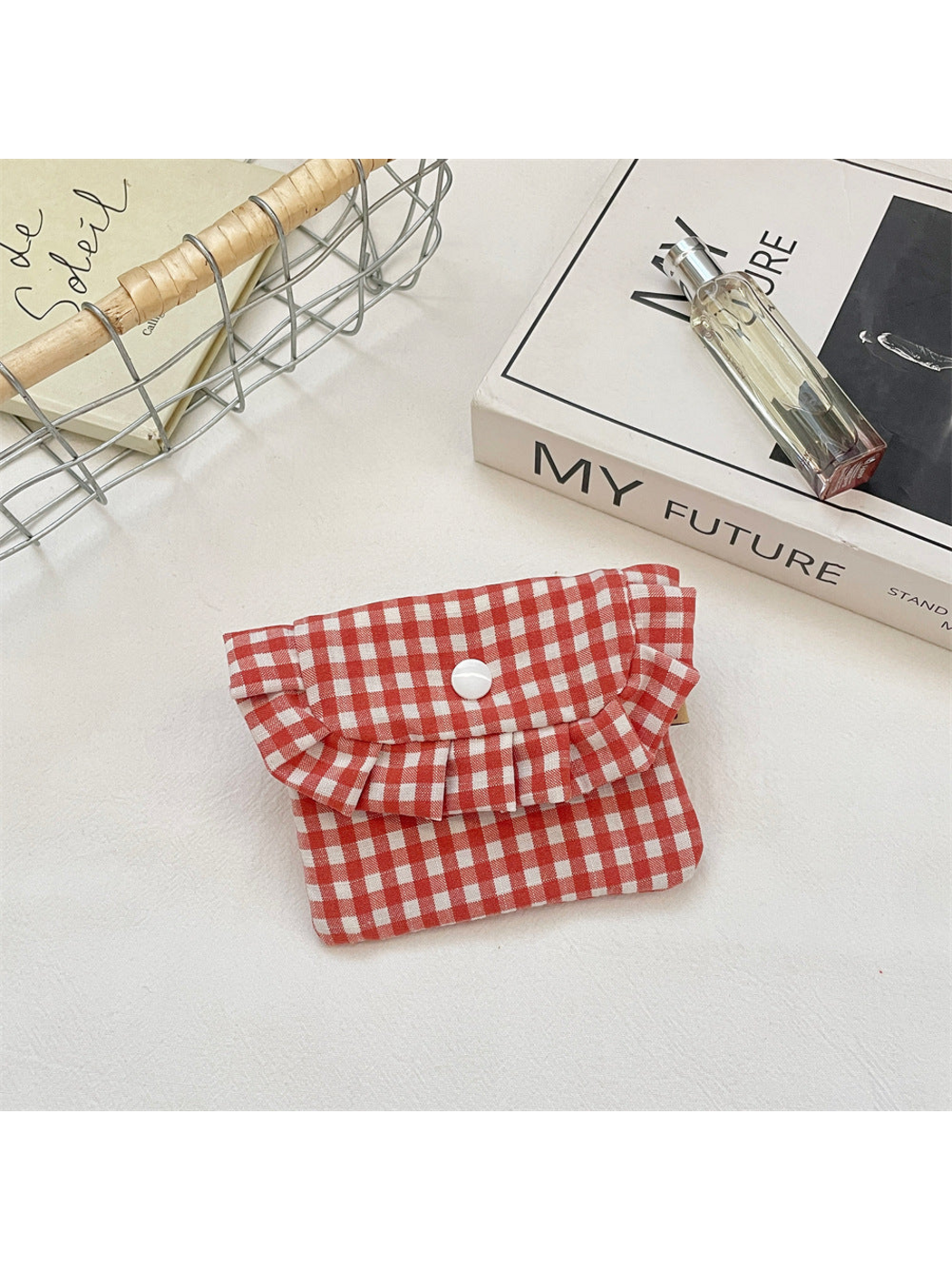 Red gingham coin purse with a ruffled flap and centered white snap