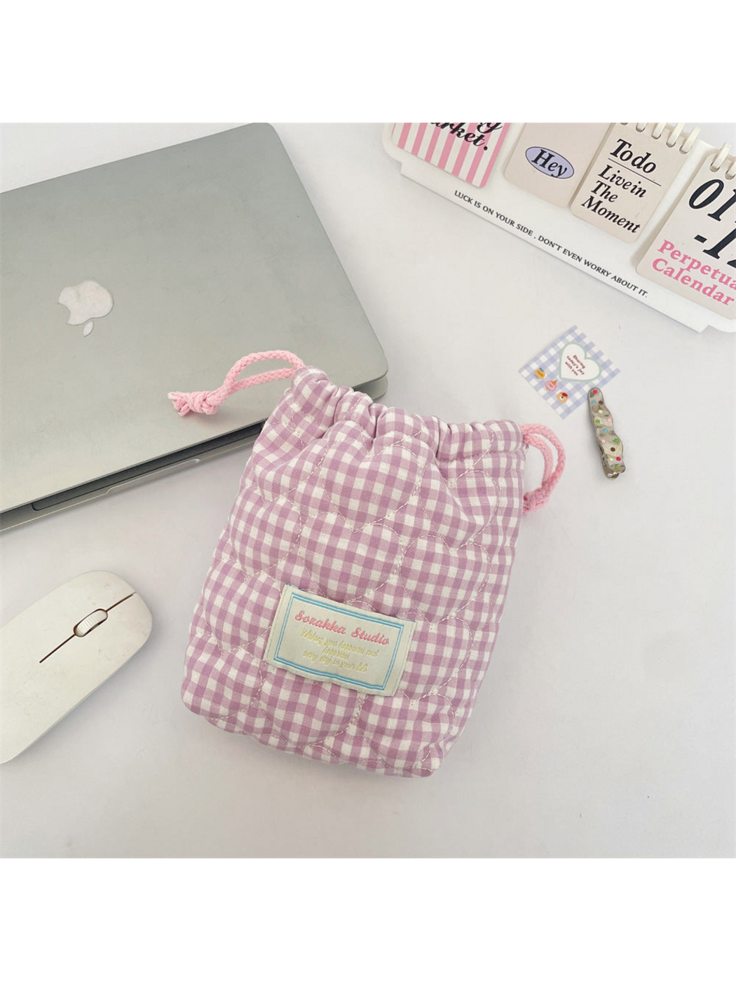 Light Purple gingham drawstring pouch with heart-shaped quilting and a blue-bordered front label