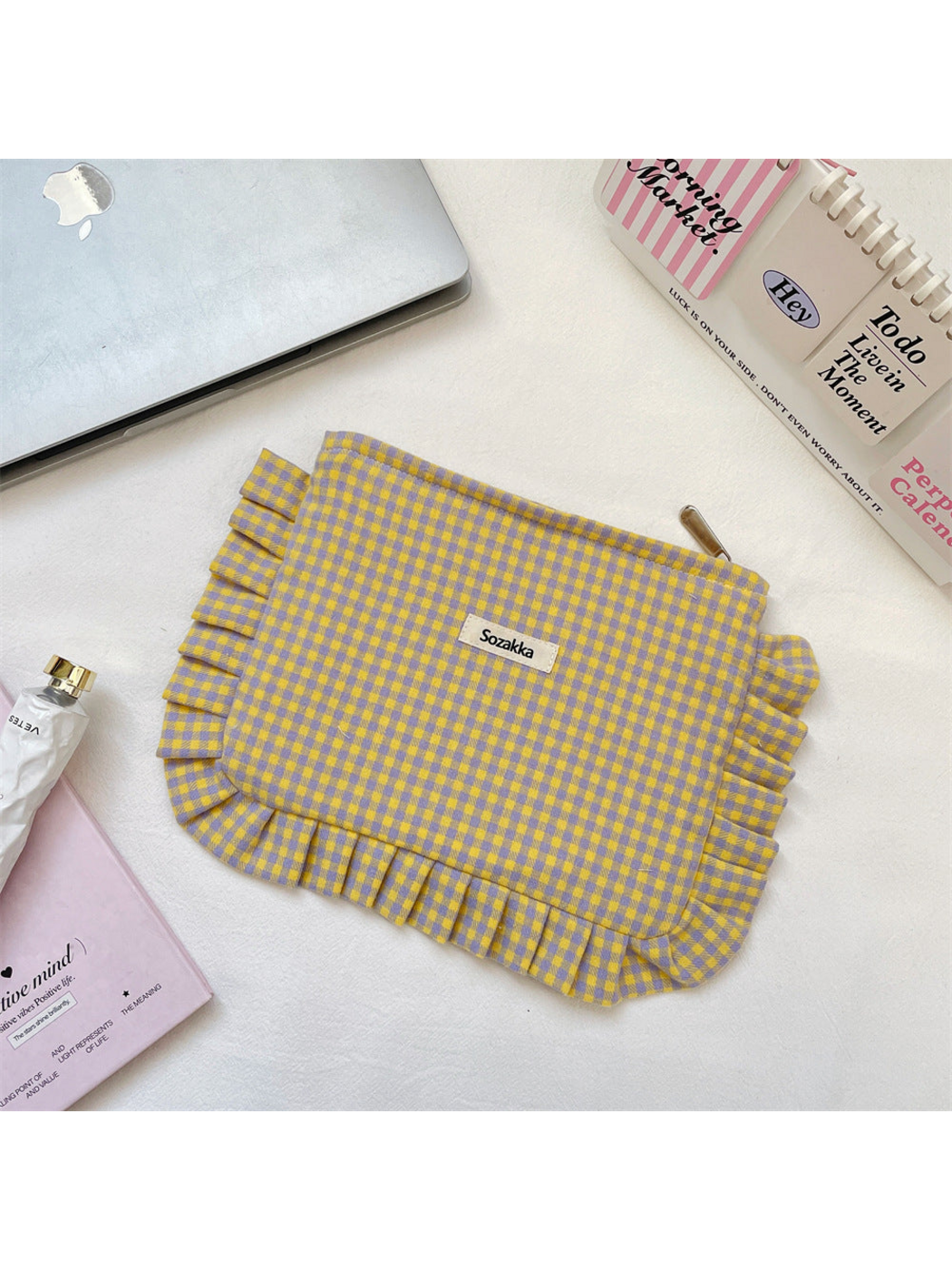 Purple makeup pouch with yellow gingham checks and ruffled edging