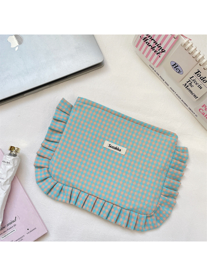 Turquoise gingham cosmetic pouch with peach checks and ruffled trim, flat front view