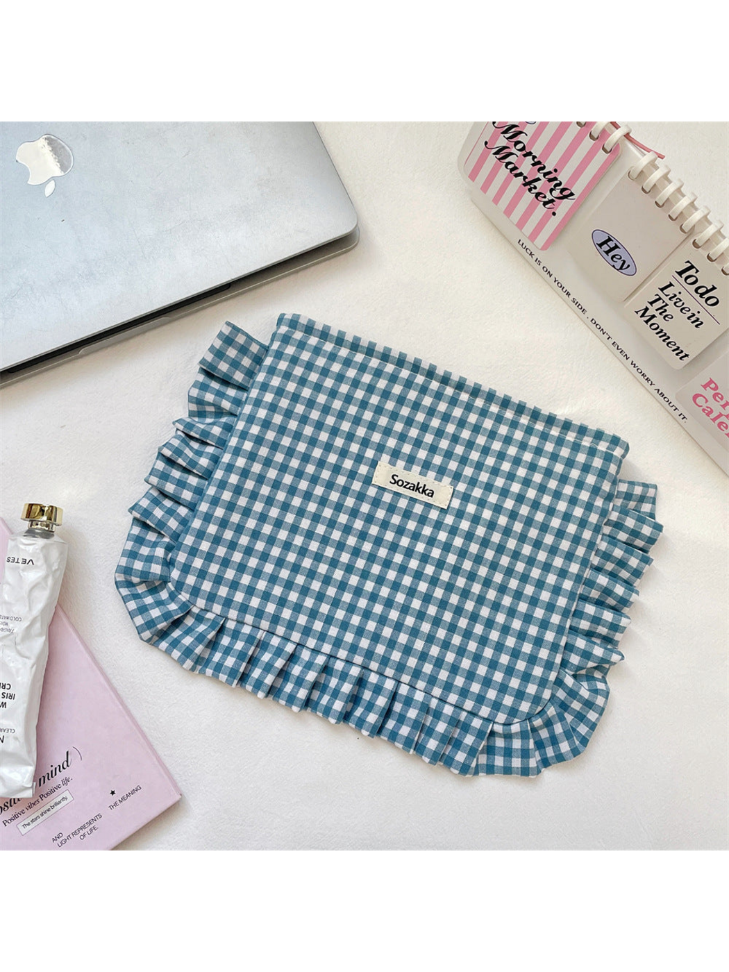 Teal Blue gingham cosmetic pouch with white checks and ruffled trim, flat front view