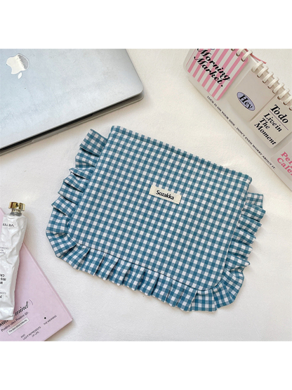 Teal Blue gingham cosmetic pouch with white checks and ruffled trim, flat front view