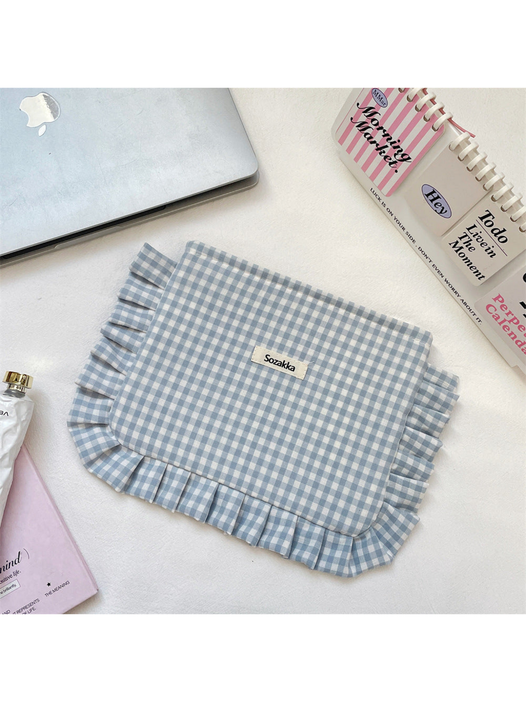 Gray Blue gingham cosmetic pouch with white checks and ruffled trim, flat front view
