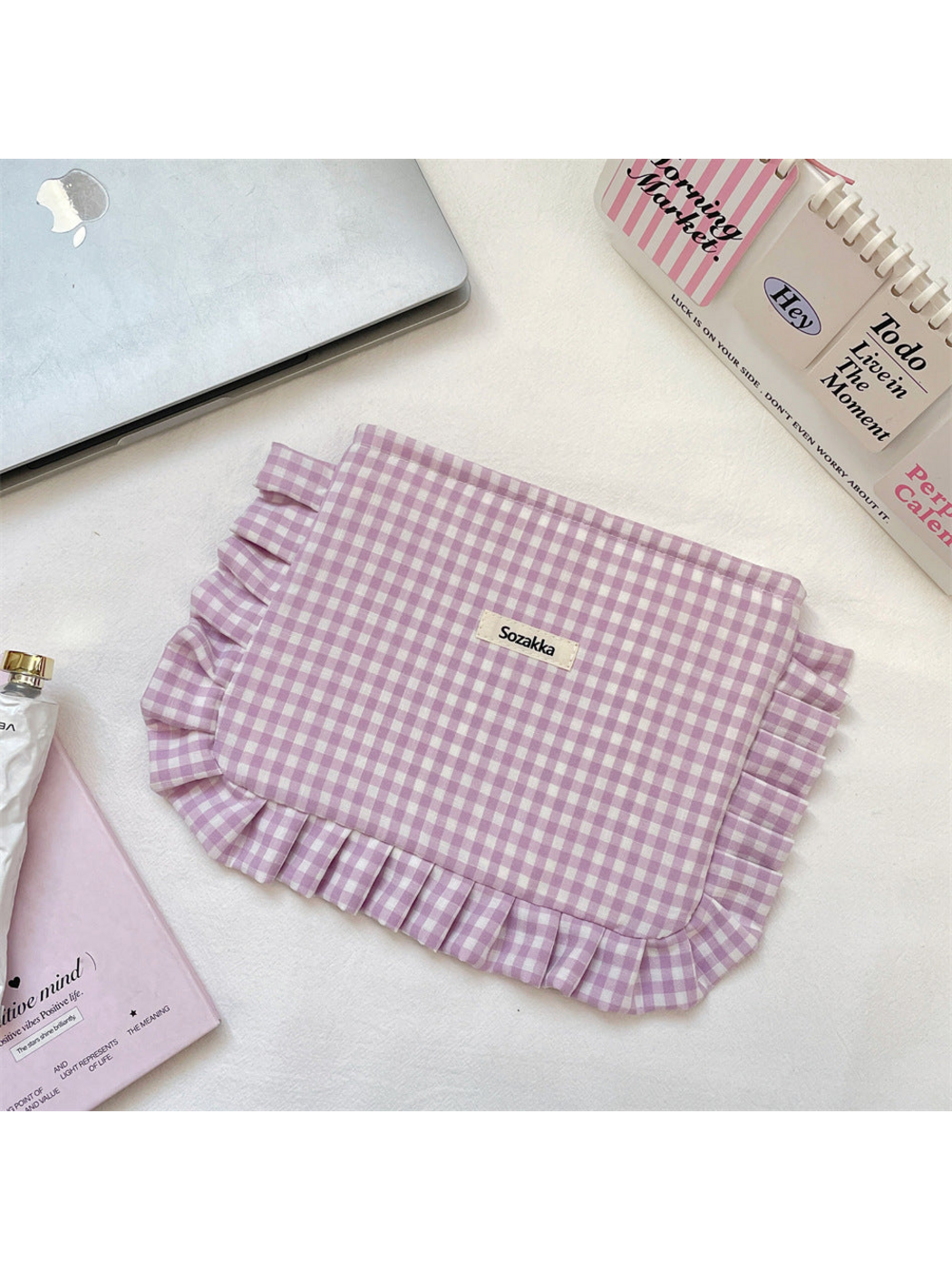 Light Purple gingham cosmetic pouch with white checks and ruffled trim, flat front view