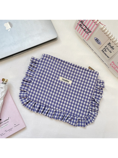 Purple gingham cosmetic pouch with white checks and ruffled trim, flat front view