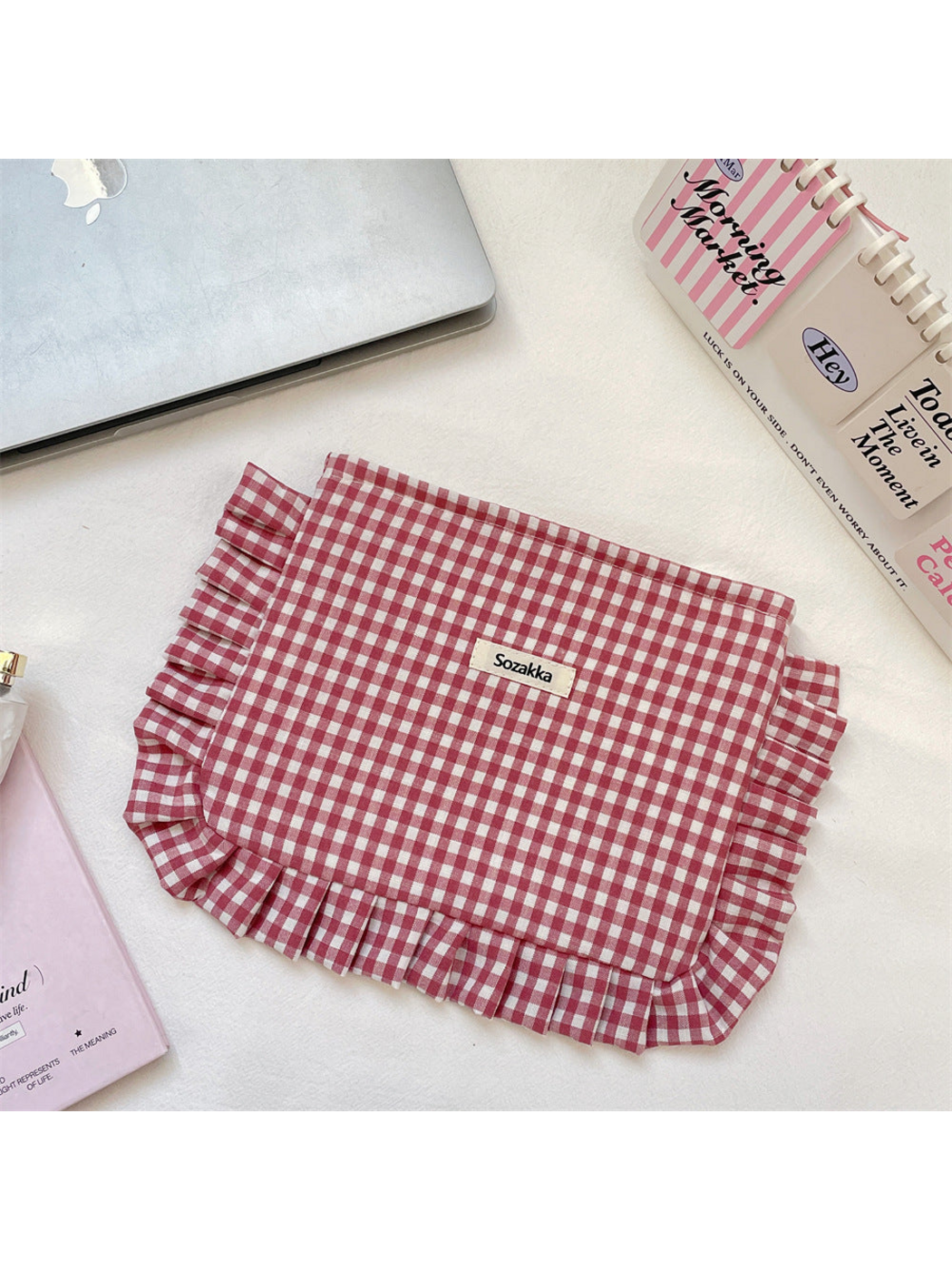 Burgundy gingham cosmetic pouch with white checks and ruffled trim, flat front view