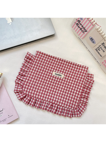Burgundy gingham cosmetic pouch with white checks and ruffled trim, flat front view
