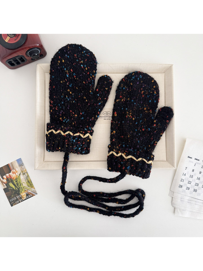 Black flecked mittens with cream zigzag cuffs and a connecting cord