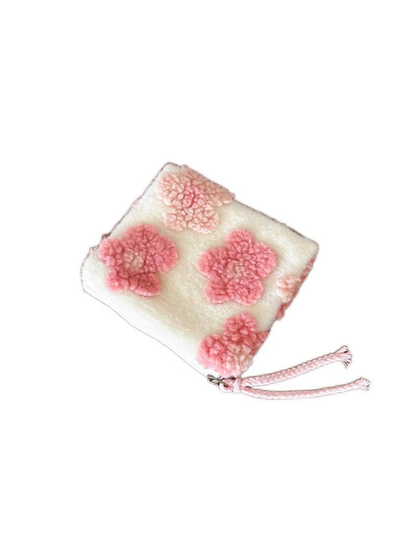 Flowers makeup bag with raised pink flowers and a pink cord pull on white