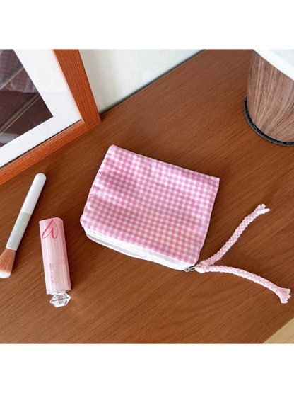 Pink Gingham makeup bag with small checks and a pink braided cord pull