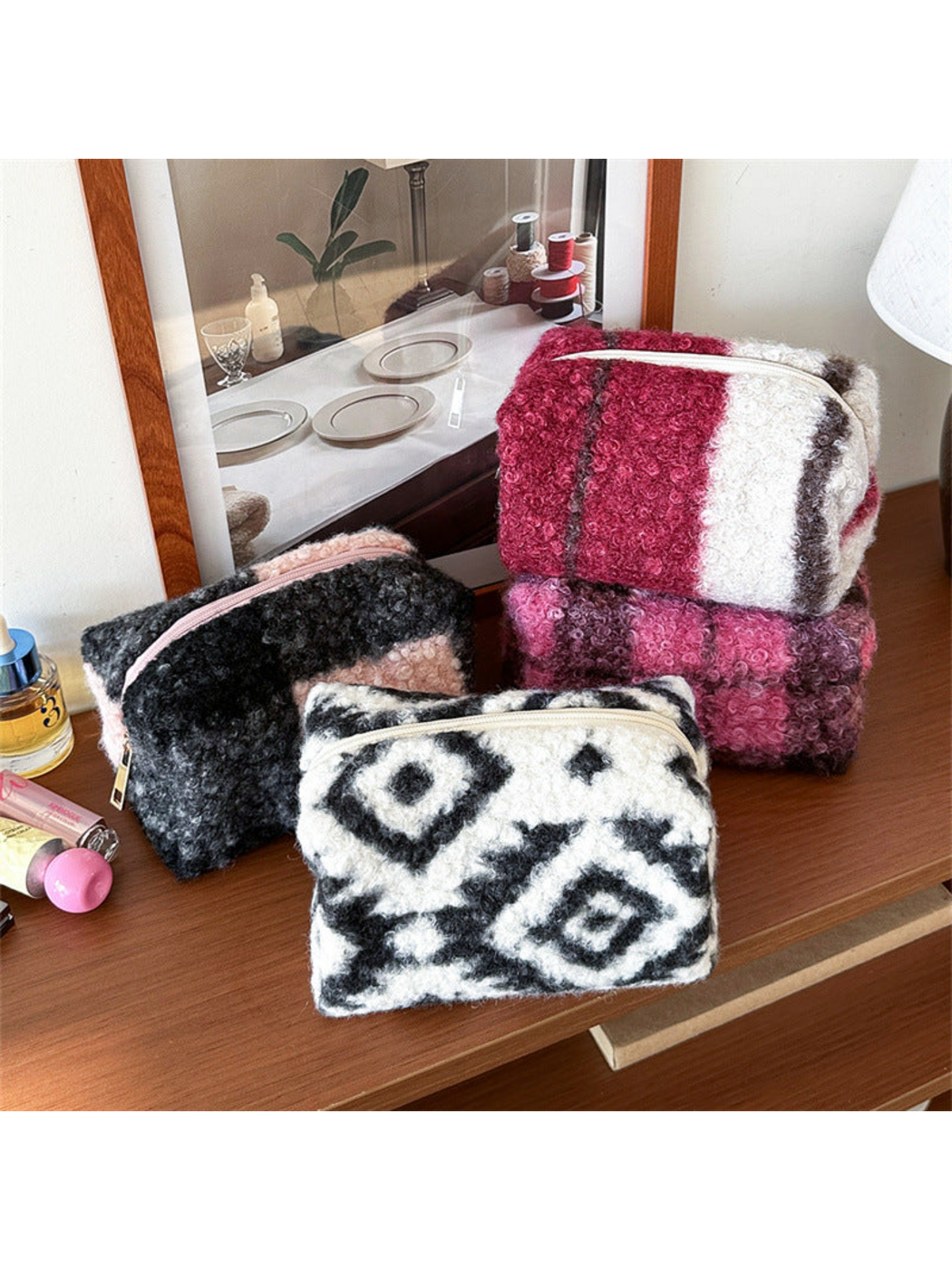 Diamond, Black Check, Red and Purple makeup bags in a stacked tabletop display