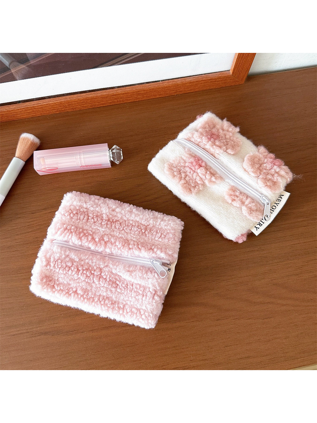 Stripes and Flowers makeup bags displayed together on a wooden surface