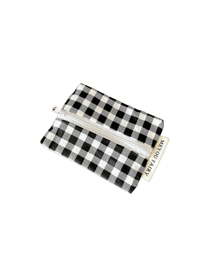 Checks makeup bag with a black-and-white pattern on a white background