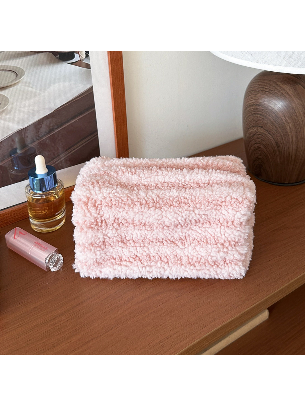 Light Pink cosmetic pouch with horizontal texture bands, front view
