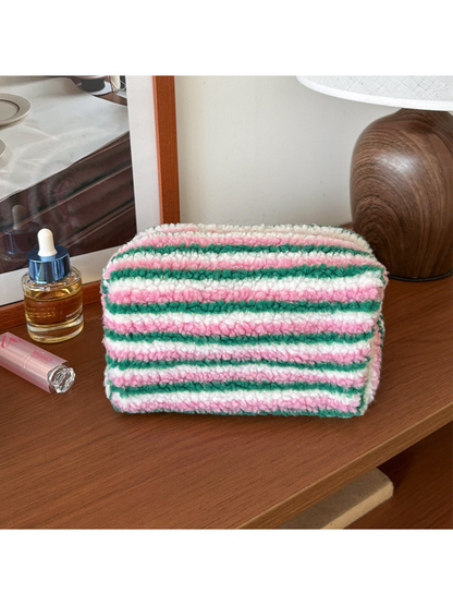 Green cosmetic pouch with green, white and pink horizontal stripes, front view