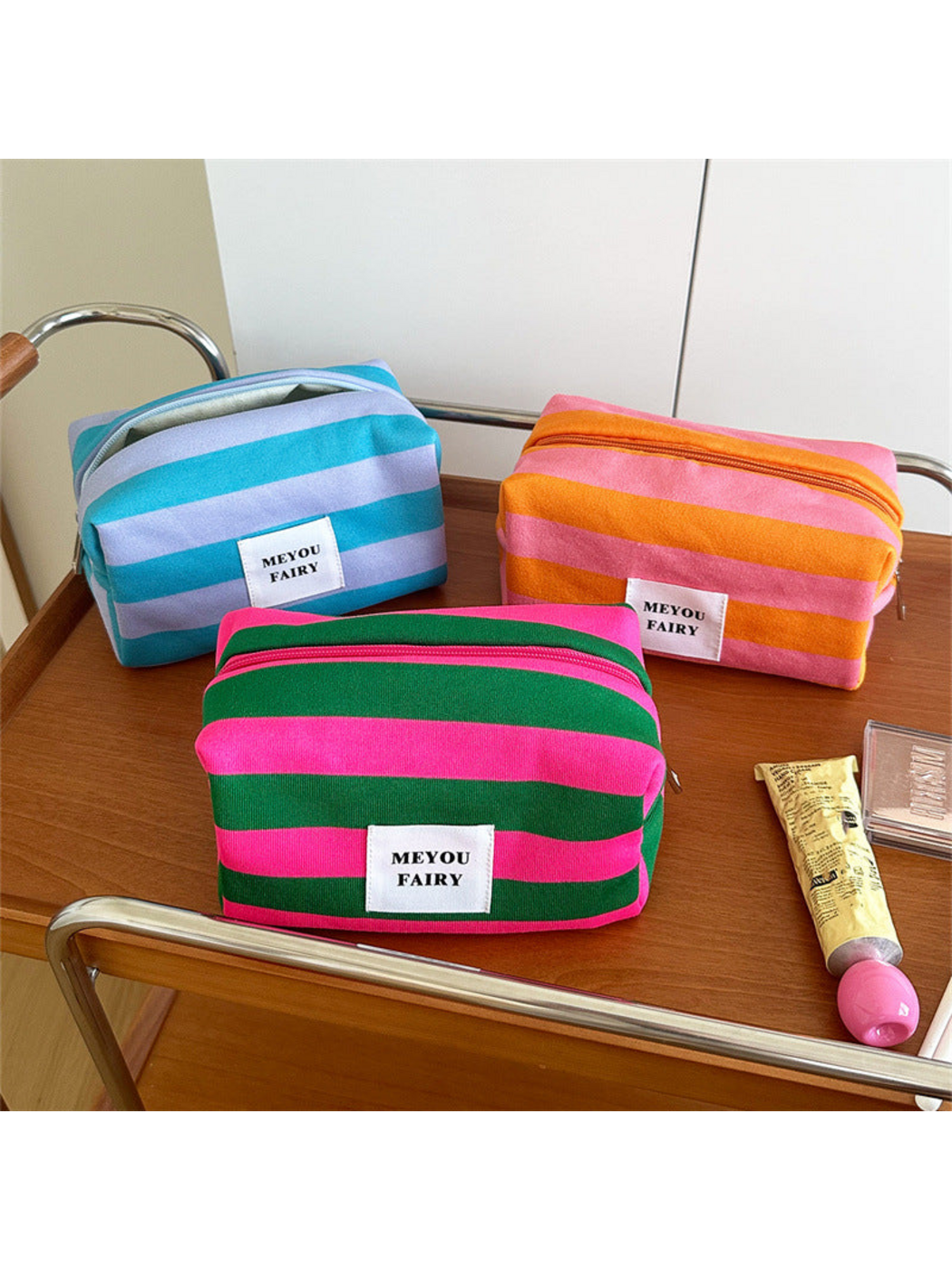 Turquoise, Orange and Green striped makeup bags displayed together
