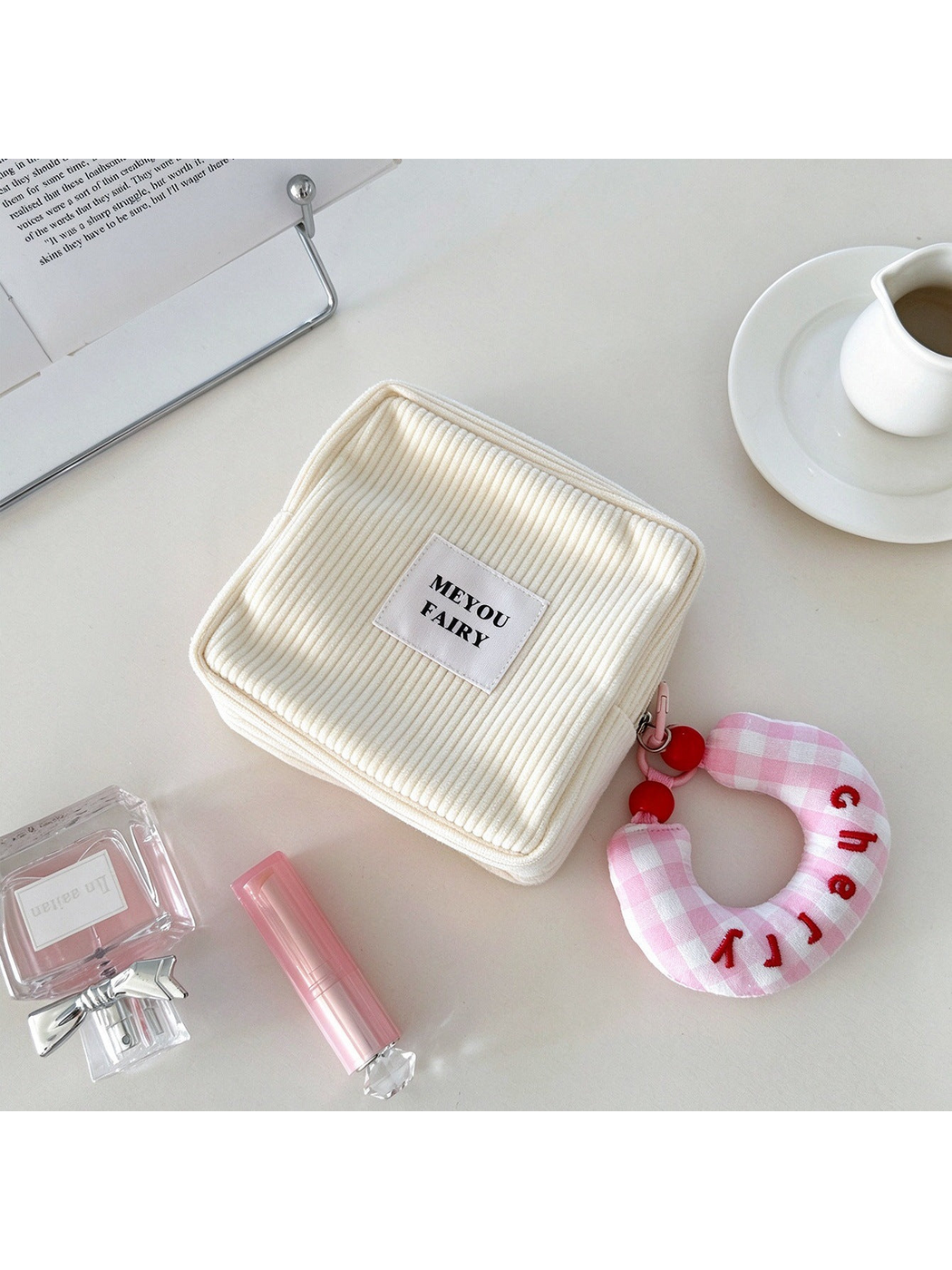 Beige ribbed makeup bag with pink checked charm