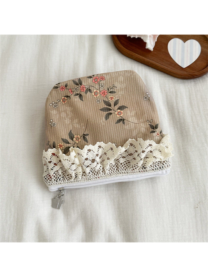 Beige pouch with flowering vines and ivory lace trim, flat view