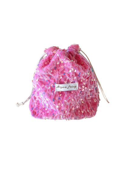 Pink sequined drawstring pouch with pale cords and a rectangular front label on white