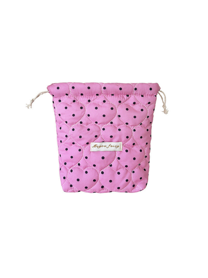 Rose Pink cosmetic pouch with black polka dots, heart-shaped quilting and drawstrings on white